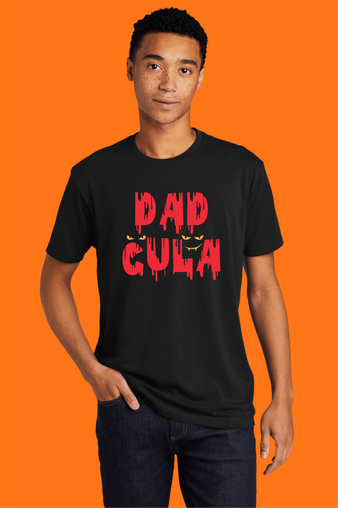 Sink your teeth into style this Halloween with our "Dadcula" tee!